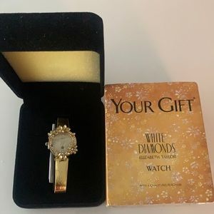 Dainty Gold Watch by Elizabeth Taylor.